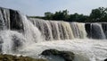 A beautiful waterfall with mossy rocks and clean water in Indonesia