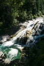 Beautiful waterfall at the mountain. Waterfall in tropical green tree forest. Waterfall is flowing in jungle. Nature abstract Royalty Free Stock Photo