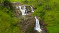 Waterfall among green hills. St. Clair Falls, Sri Lanka.