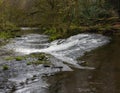 Beautiful waterfall on the River Cusher in the Clare Glens Forest Royalty Free Stock Photo
