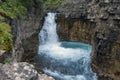 Beautiful waterfall among rocks in form of cup. Tekes waterfall in Kazakhstan. Royalty Free Stock Photo