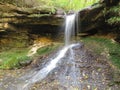 Beautiful waterfall. Spring weather. A small lake. Royalty Free Stock Photo