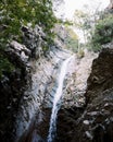 Beautiful waterfall, stone cliff. Picturesque landscape with beautiful waterfall, stone cliff