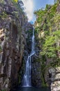 Beautiful waterfall of Veu da Noiva between the covered stones of moss and the vegetation