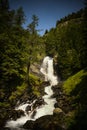 Beautiful waterfall in a wood on the Italian Dolomites Royalty Free Stock Photo
