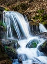 Beautiful waterfalls with mossy rocks in the forest Royalty Free Stock Photo