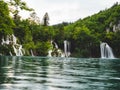 Beautiful waterfalls surrounded by lush greenery in Plitvice Lakes National Park. Croatia Royalty Free Stock Photo