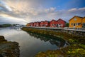 Beautiful waterfront house reflecting the water Evening and twilight sky at ballstad city, lofoten island