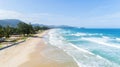 Beautiful wave crashing on sandy shore at karon beach in phuket