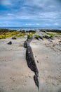 Beautiful waves break on the black rocks Royalty Free Stock Photo