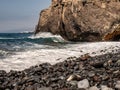 Beautiful waves roll to the beach with views to the coast