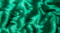 Beautiful wavy background of plush, emerald green velvet fur texture Royalty Free Stock Photo