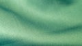 Beautiful wavy silk fabric in aqua color. Smooth elegant luxury cloth fabric texture. Abstract green background design. Copy space Royalty Free Stock Photo