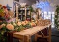 Beautiful wax candle light romantic flame on dinner table at wedding banquet reception. Row of gold coloured vintage Royalty Free Stock Photo