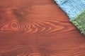 Beautiful waxed wooden background with scarf side view. flat lay top view