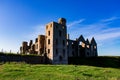 Slains Castle East wall in sunny day and blue sky zoom out Royalty Free Stock Photo