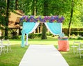 Beautiful wedding arch with flowers in garden Royalty Free Stock Photo