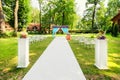 Beautiful wedding arch with flowers in garden Royalty Free Stock Photo