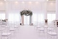 Beautiful wedding archway. Arch decorated with peachy and silvery cloth and flowers