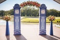 Beautiful wedding archway. Arch like clocks decorated with peachy flowers Royalty Free Stock Photo