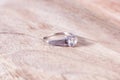 Beautiful wedding background with diamond engagement wedding ring on wooden desk Royalty Free Stock Photo