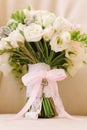 Beautiful wedding bouquet for the bride decorated with a key pendant on the handle