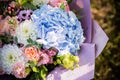 Beautiful bouquet of bride wedding flowers blue hydrangea, fresh pink roses and alstroemeria, bridal decoration. Fresh Royalty Free Stock Photo