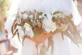 Beautiful wedding bouquet in bride`s hand. Royalty Free Stock Photo