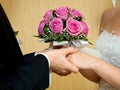 Beautiful wedding bouquet in brides and grooms hands Royalty Free Stock Photo