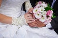 Beautiful wedding bouquet in brides and grooms hands Royalty Free Stock Photo