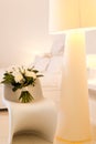 Beautiful wedding bouquet on a chair. Beige lamp Royalty Free Stock Photo