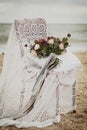 Beautiful Wedding bouquet in a chair on a seaside