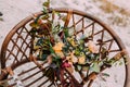Beautiful wedding bouquet consisting of different flowers lying on an old brown chair. Bunch of flowers Royalty Free Stock Photo