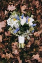 Beautiful wedding bouquet of different white, blue, green flower Royalty Free Stock Photo