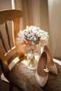 Beautiful wedding bouquet of dry flowers and bride`s shoes. Royalty Free Stock Photo