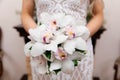 Wedding bouquet of flowers in the hands of the bride Royalty Free Stock Photo