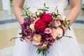 Wedding bouquet of flowers in the hands of the bride Royalty Free Stock Photo