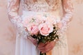 Wedding bouquet of flowers in the hands of the bride Royalty Free Stock Photo