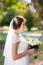 Beautiful wedding bouquet of flowers in hands of young bride Royalty Free Stock Photo