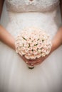 Beautiful wedding bouquet in hands of the bride Royalty Free Stock Photo