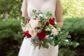 Beautiful wedding bouquet in the hands of the bride Royalty Free Stock Photo
