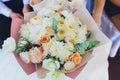 Beautiful wedding bouquet in the hands of the bride with roses. Wedding day. Bokeh. Bride. Bride`s bouquet. Wedding Royalty Free Stock Photo