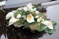 Beautiful wedding bouquet on the hood of the car Royalty Free Stock Photo