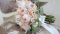 Beautiful wedding bouquet with pink flowers lying on the chair in the room Royalty Free Stock Photo