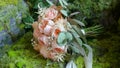 Beautiful wedding bouquet with pink flowers lying on the chair in the room Royalty Free Stock Photo