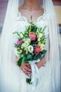 Beautiful wedding bouquet with pink and white roses in bride`s hands in wedding day. Wedding decor. Idea for bridal bouquet. Royalty Free Stock Photo