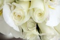 Beautiful wedding bouquet of roses and orchids and two gold and platinum wedding rings