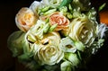 Beautiful wedding bouquet. Roses in pastel colors. Bridal flowers. Golden rings for couple Royalty Free Stock Photo