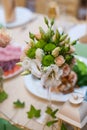 Beautiful wedding bouquet on a table of white and beige roses Royalty Free Stock Photo