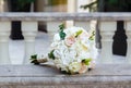 Beautiful wedding bouquet on vintage marble banister